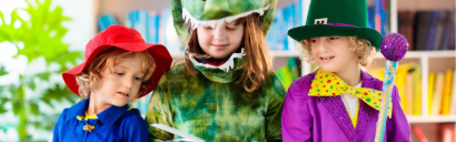 children dressed as Paddington Bear dinosaur and clown