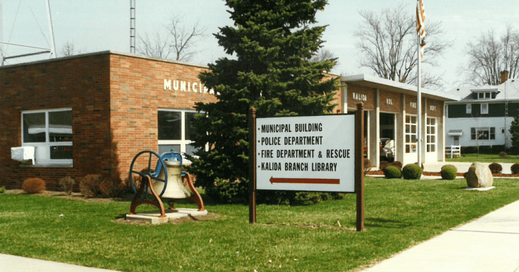 Municipal Building with sign and bell