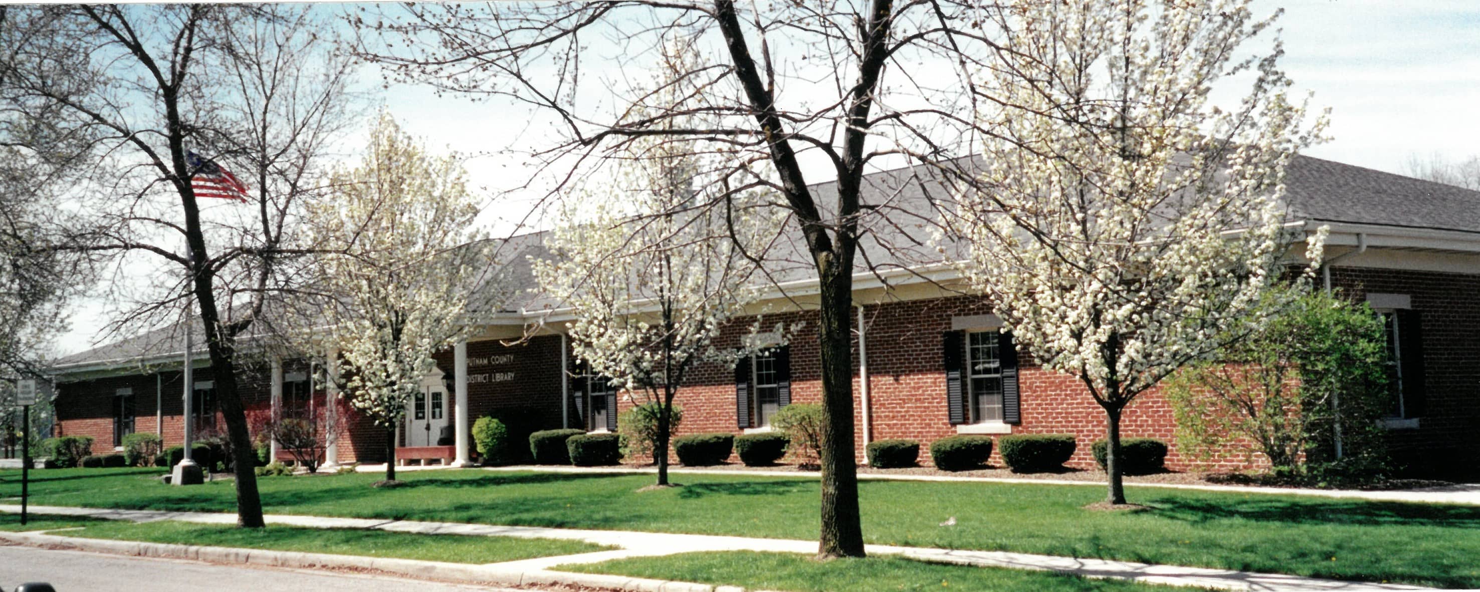 library building with flowering trees