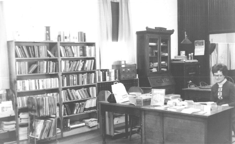 Inside of library bookcases and desk