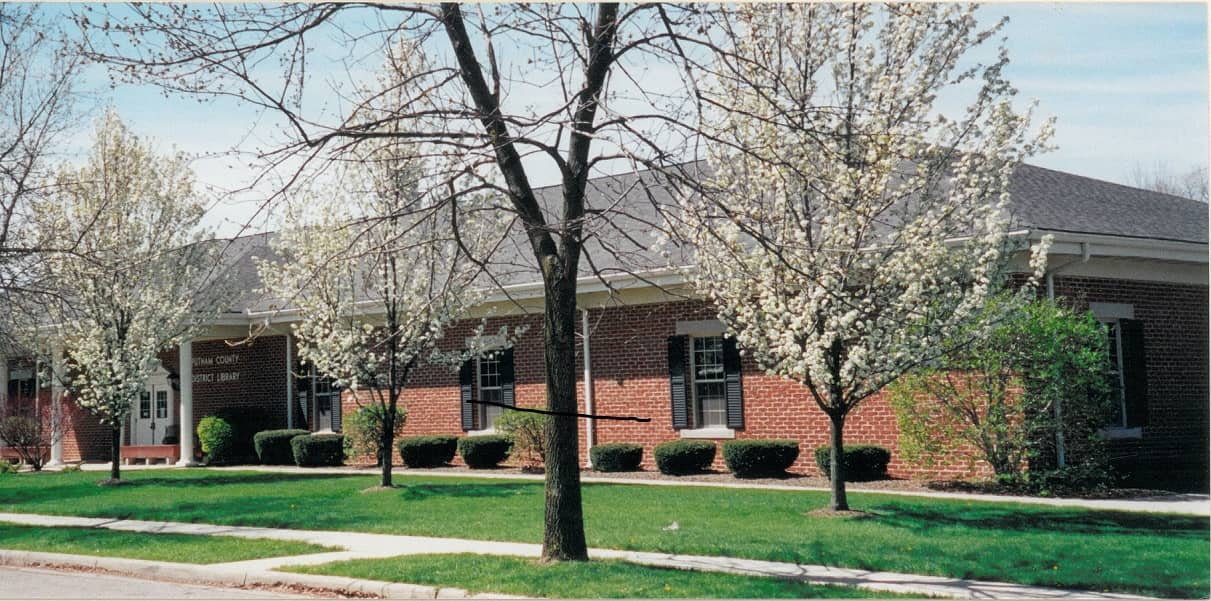 building with flowering trees in front Putnam  County District Library on building